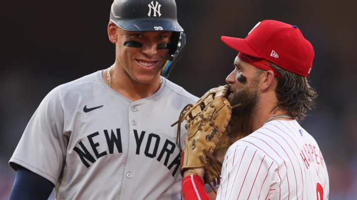 Jul 30, 2024: New York Yankees outfielder Aaron Judge with Philadelphia Phillies first base Bryce Harper on first base after his single during the first inning at Citizens Bank Park.