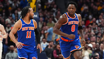 Nov 25, 2024; Denver, Colorado, USA; New York Knicks guard Jalen Brunson (11) reacts towards forward OG Anunoby (8) in the second quarter against the Denver Nuggets at Ball Arena. Mandatory Credit: Ron Chenoy-Imagn Images