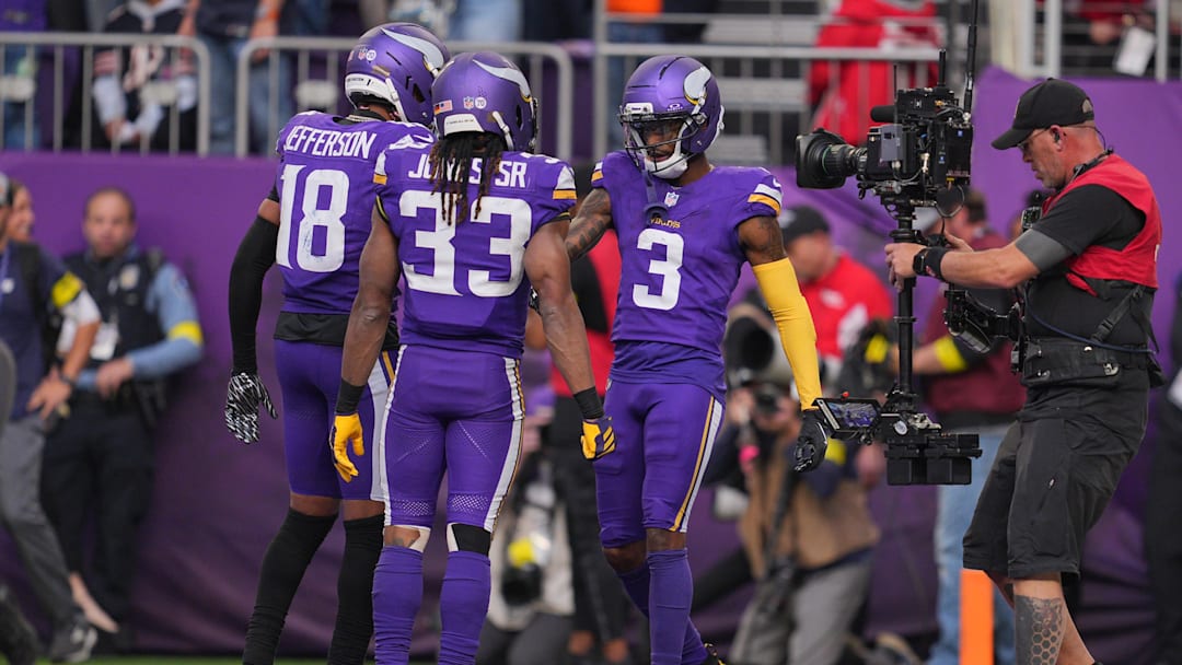 Nov 16, 2025; Minneapolis, Minnesota, USA; Minnesota Vikings wide receiver Jordan Addison (3) celebrates a touchdown with wide receiver Justin Jefferson (18) and running back Aaron Jones (33) during the fourth quarter against the Chicago Bears at U.S. Bank Stadium. Mandatory Credit: Brad Rempel-Imagn Images