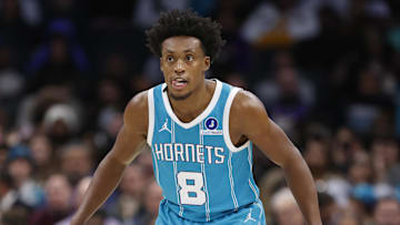 Nov 10, 2025; Charlotte, North Carolina, USA; Charlotte Hornets guard Collin Sexton (8) gets into his defensive stance during the second half against the Los Angeles Lakers at Spectrum Center. Mandatory Credit: Brian Westerholt-Imagn Images