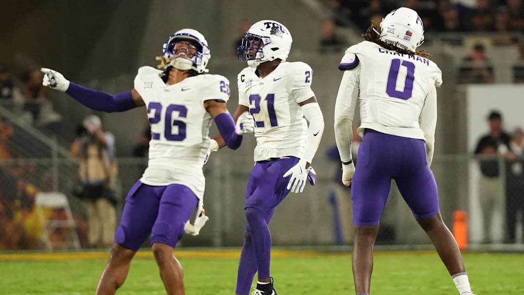 Sep 26, 2025; Tempe, Arizona, USA; TCU Horned Frogs safety Bud Clark (21) celebrates with cornerback Vernon Glover (26) and defensive end Zach Chapman (0) against the Arizona State Sun Devils in the first half at Mountain America Stadium, Home of the ASU Sun Devils. Mandatory Credit: Jacob Reiner-Imagn Images