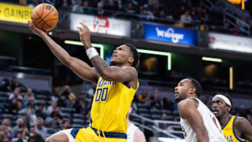 Dec 1, 2025; Indianapolis, Indiana, USA;  Indiana Pacers guard Bennedict Mathurin (00) shoots the ball while Cleveland Cavaliers center Evan Mobley (4) defends in the second half at Gainbridge Fieldhouse. Mandatory Credit: Trevor Ruszkowski-Imagn Images
