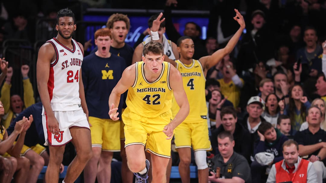 Oct 25, 2025; New York, NY, USA;  Michigan Wolverines forward Will Tschetter (42) celebrates after making a three point shot in overtime against the St. John's Red Storm at Madison Square Garden. Mandatory Credit: Wendell Cruz-Imagn Images