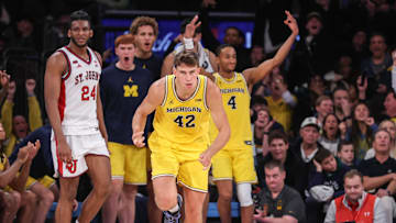 Oct 25, 2025; New York, NY, USA;  Michigan Wolverines forward Will Tschetter (42) celebrates after making a three point shot in overtime against the St. John's Red Storm at Madison Square Garden. Mandatory Credit: Wendell Cruz-Imagn Images