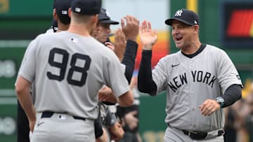 Apr 4, 2025; Pittsburgh, Pennsylvania, USA; New York Yankees manager Aaron Boone (17) greets his team during player introductions against the Pittsburgh Pirates n the 2025 Opening Day game at PNC Park. 