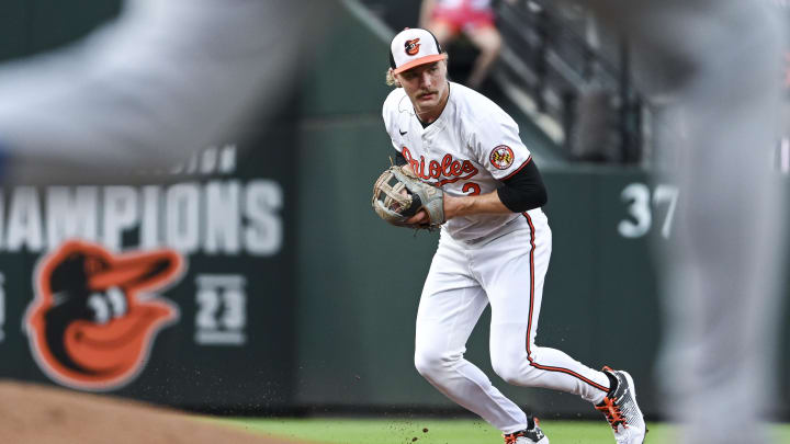 Jul 11, 2024; Baltimore, Maryland, USA; Baltimore Orioles shortstop Gunnar Henderson (2) fields a run Chicago Cubs third baseman Christopher Morel (5) second inning groundball at Oriole Park at Camden Yards. Mandatory Credit: Tommy Gilligan-USA TODAY Sports