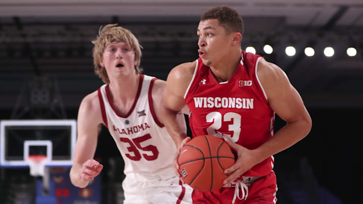 Nov 22, 2018; Paradise Island, BAHAMAS; Wisconsin Badgers guard Kobe King (23) drives to the basket past Oklahoma Sooners forward Brady Manek (35) during the second half at Imperial Arena.