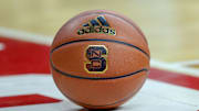 Feb 20, 2019; Raleigh, NC, USA; Basketball with the North Carolina State Wolfpack logo sits on the court during a timeout as the Wolfpack play the Boston College Eagles in the first half at PNC Arena. The North Carolina State Wolfpack won 89-80. Mandatory Credit: Nell Redmond-Imagn Images