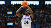 Nov 15, 2025; Lawrence, Kansas, USA; Kansas Jayhawks guard Melvin Council Jr. (14) shoots during the first half against the Princeton Tigers at Allen Fieldhouse. Mandatory Credit: Jay Biggerstaff-Imagn Images