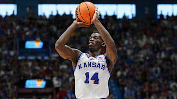 Nov 15, 2025; Lawrence, Kansas, USA; Kansas Jayhawks guard Melvin Council Jr. (14) shoots during the first half against the Princeton Tigers at Allen Fieldhouse. Mandatory Credit: Jay Biggerstaff-Imagn Images