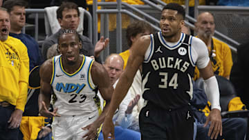 Apr 19, 2025; Indianapolis, Indiana, USA;  Indiana Pacers forward Aaron Nesmith (23) celebrates a made basket  in the first half against the Milwaukee Bucks at Gainbridge Fieldhouse. Mandatory Credit: Trevor Ruszkowski-Imagn Images