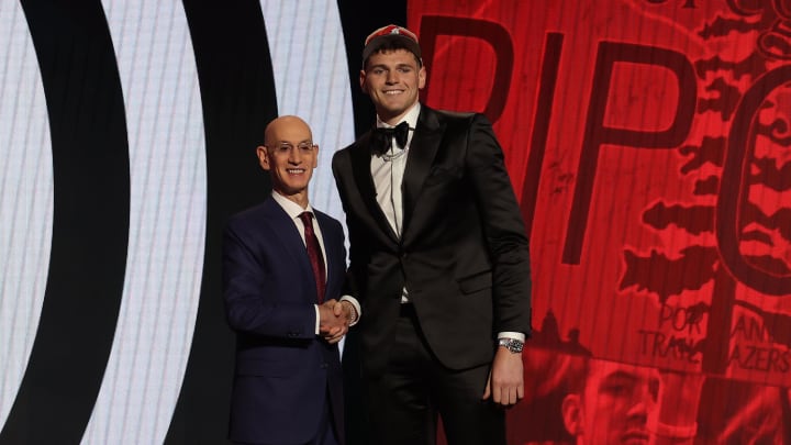 Jun 26, 2024; Brooklyn, NY, USA; Donovan Clingan poses for photos with NBA commissioner Adam Silver after being selected in the first round by the Portland Trail Blazers in the 2024 NBA Draft at Barclays Center. Mandatory Credit: Brad Penner-USA TODAY Sports