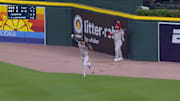 Red Sox outfielders Rafaela and Abreu celebrate a robbed home run.