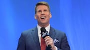 NFL Network broadcaster Scott Hanson speaks with the Lombardi trophy by his side in 2018.