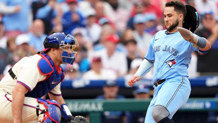 Jun 14, 2025; Philadelphia, Pennsylvania, USA; Toronto Blue Jays infielder Bo Bichette (11) slides home to score against the Philadelphia Phillies in the fifth inning at Citizens Bank Park. Mandatory Credit: Kyle Ross-Imagn Images