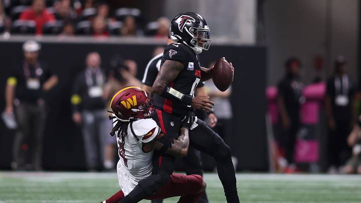 Sep 28, 2025; Atlanta, Georgia, USA; Washington Commanders linebacker Frankie Luvu (4) sacks Atlanta Falcons quarterback Michael Penix Jr. (9) during the first half at Mercedes-Benz Stadium. Mandatory Credit: Brett Davis-Imagn Images