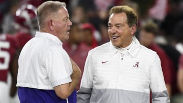 Nov 4, 2023; Tuscaloosa, Alabama, USA;  LSU Tigers head coach Brian Kelly and Alabama Crimson Tide head coach Nick Saban talk together at midfield before the Alabama vs LSU game at Bryant-Denny Stadium. Mandatory Credit: Gary Cosby Jr.-USA TODAY Sports