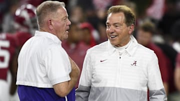 Nov 4, 2023; Tuscaloosa, Alabama, USA;  LSU Tigers head coach Brian Kelly and Alabama Crimson Tide head coach Nick Saban talk together at midfield before the Alabama vs LSU game at Bryant-Denny Stadium. Mandatory Credit: Gary Cosby Jr.-Imagn Images