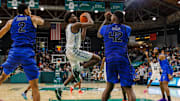 Jan 30, 2025; New Orleans, Louisiana, USA;  Tulane Green Wave forward Kaleb Banks (1) drives to the basket against Memphis Tigers forward Dain Dainja (42) during the second half at Avron B. Fogelman Arena in Devlin Fieldhouse.
