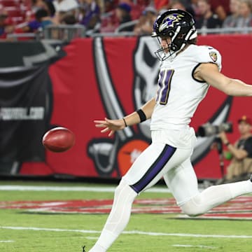 Aug 26, 2023; Tampa, Florida, USA; Baltimore Ravens punter Jordan Stout (11) punts the ball against the Tampa Bay Buccaneers during the second quarter at Raymond James Stadium. Mandatory Credit: Kim Klement Neitzel-Imagn Images