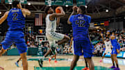 Jan 30, 2025; New Orleans, Louisiana, USA;  Tulane Green Wave forward Kaleb Banks (1) drives to the basket against Memphis Tigers forward Dain Dainja (42) during the second half at Avron B. Fogelman Arena in Devlin Fieldhouse.