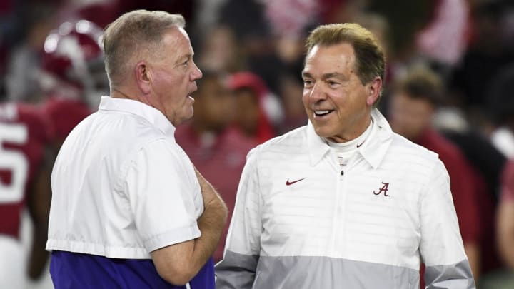 Nov 4, 2023; Tuscaloosa, Alabama, USA;  LSU Tigers head coach Brian Kelly and Alabama Crimson Tide head coach Nick Saban talk together at midfield before the Alabama vs LSU game at Bryant-Denny Stadium. Mandatory Credit: Gary Cosby Jr.-USA TODAY Sports