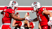 Oct 4, 2025; Raleigh, North Carolina, USA;  NC State Wolfpack tight end Justin Joly (7) and tight end Cody Hardy (44) celebrate a touchdown during the first half of the game against Campbell Fighting Camels at Carter-Finley Stadium. Mandatory Credit: Jaylynn Nash-Imagn Images