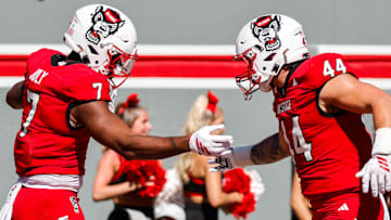 Oct 4, 2025; Raleigh, North Carolina, USA;  NC State Wolfpack tight end Justin Joly (7) and tight end Cody Hardy (44) celebrate a touchdown during the first half of the game against Campbell Fighting Camels at Carter-Finley Stadium. Mandatory Credit: Jaylynn Nash-Imagn Images