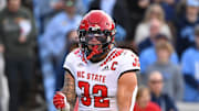 Nov 25, 2022; Chapel Hill, North Carolina, USA; North Carolina State Wolfpack linebacker Drake Thomas (32) reacts in the first quarter at Kenan Memorial Stadium. Mandatory Credit: Bob Donnan-Imagn Images