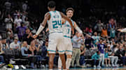 Nov 6, 2024; Charlotte, North Carolina, USA; Charlotte Hornets forward Brandon Miller (24) and guard LaMelo Ball (1) high five after a dunk and assist during the second half against the Detroit Pistons at Spectrum Center. Mandatory Credit: Jim Dedmon-Imagn Images