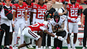 Oct 25, 2025; Lubbock, Texas, USA;  Oklahoma State Cowboys wide receiver Gavin Freeman (17) is tackled by Texas Tech Red Raiders defensive back Dontae Balfour (20) in the first half at Jones AT&T Stadium. Mandatory Credit: Michael C. Johnson-Imagn Images