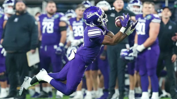 Northwestern Wildcats wide receiver A.J. Henning (8) makes a catch against the Utah Utes during the fourth quarter at Allegia