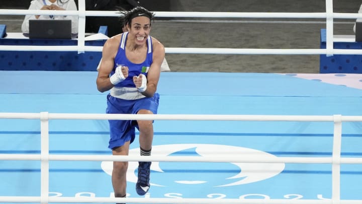 Aug 6, 2024; Paris, France; Imane Khelif (ALG) celebrates defeating Janjaem Suwannapheng (THA) in a women's 66kg bronze medal bout during the Paris 2024 Olympic Summer Games at Stade Roland Garros. Mandatory Credit: Michael Madrid-USA TODAY Sports