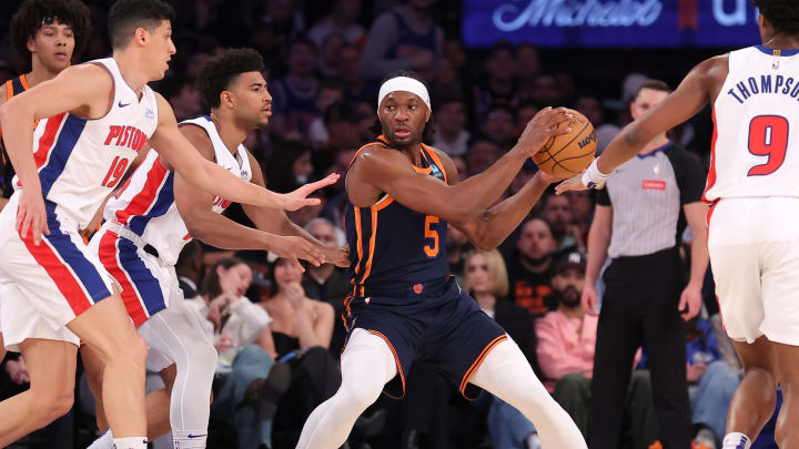 Feb 26, 2024; New York, New York, USA; New York Knicks forward Precious Achiuwa (5) controls the ball against Detroit Pistons guard Quentin Grimes (24) and forwards Simone Fontecchio (19) and Ausar Thompson (9) during the first quarter at Madison Square Garden. Mandatory Credit: Brad Penner-USA TODAY Sports