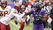 TCU Horned Frogs running back Emari Demercado is knocked out of bounds by Iowa State Cyclones defensive back Darien Porter.