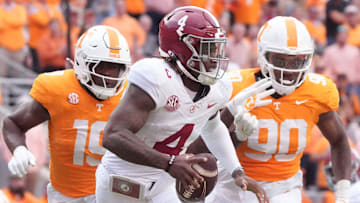 Alabama quarterback Jalen Milroe (4) is pressured by Tennessee defensive linemen Joshua Josephs (19) and Dominic Bailey (90) during an NCAA college football game on Saturday, Oct. 19, 2024, in Knoxville. Tenn.