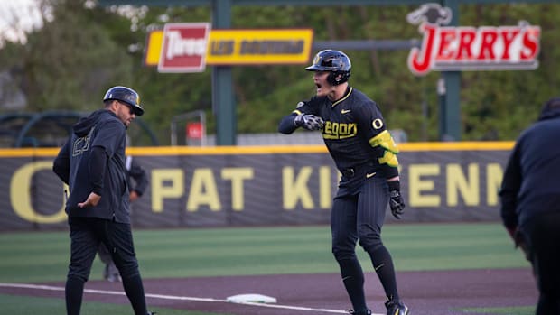 Outfielder Bryce Boettcher rallies the crowd after hitting a home run as the Oregon Ducks host the Oregon State Beaver 