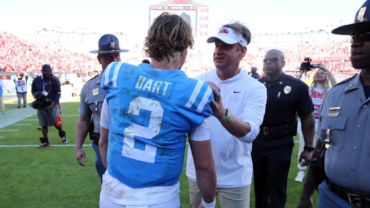 Nov 4, 2023; Oxford, Mississippi, USA; Mississippi Rebels quarterback Jaxson Dart (2) and Mississippi Rebels head coach Lane Kiffin (right) react after defeating the Texas A&M Aggies at Vaught-Hemingway Stadium. Mandatory Credit: Petre Thomas-USA TODAY Sports