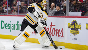 Jan 18, 2025; Ottawa, Ontario, CAN; Boston Bruins goalie Jeremy Swayman (1) moves the puck in the first period against the Ottawa Senators at the Canadian Tire Centre. Mandatory Credit: Marc DesRosiers-Imagn Images