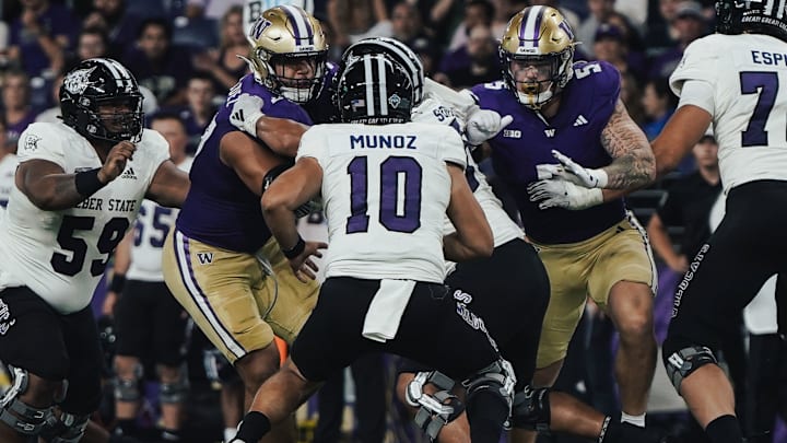 Sebastian Valdez (50) and Zach Durfee (5) put the pressure on Weber State quarterback Richie Munoz. 