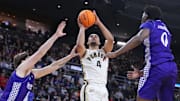 Purdue forward Trey Kaufman-Renn (4) shoots over two High Point defenders during their NCAA Tournament game on Thursday.