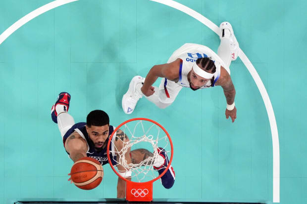 Team USA forward Jayson Tatum shoots the ball in the Olympics.