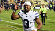 Oct 12, 2024; Boulder, Colorado, USA; Kansas State Wildcats running back Dylan Edwards (3) celebrates as he leaves the field after a win against the Colorado Buffaloes at Folsom Field. Mandatory Credit: Christopher Hanewinckel-Imagn Images