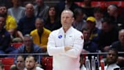 Mar 4, 2025; Salt Lake City, Utah, USA; West Virginia Mountaineers head coach Darian DeVries watches the play against the Utah Utes during the first half at Jon M. Huntsman Center. Mandatory Credit: Rob Gray-Imagn Images