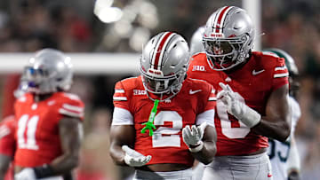 Ohio State Buckeyes safety Caleb Downs (2) reacts to a tackle during the second half of the NCAA football game against the Ohio Bobcats at Ohio Stadium on Sept. 13, 2025. Ohio State won 37-9.