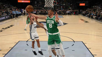 Nov 19, 2023; Memphis, Tennessee, USA; Boston Celtics center Kristaps Porzingis (8) collects a