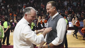 Jan 11, 2020; Blacksburg, Virginia, USA; Virginia Tech Hokies head coach Mike Young reacts with athletic director Whit Babcock following the victory against the NC State Wolfpack at Cassell Coliseum. Mandatory Credit: Michael Thomas Shroyer-Imagn Images