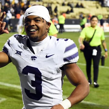 Oct 12, 2024; Boulder, Colorado, USA; Kansas State Wildcats running back Dylan Edwards (3) celebrates as he leaves the field after a win against the Colorado Buffaloes at Folsom Field. Mandatory Credit: Christopher Hanewinckel-Imagn Images