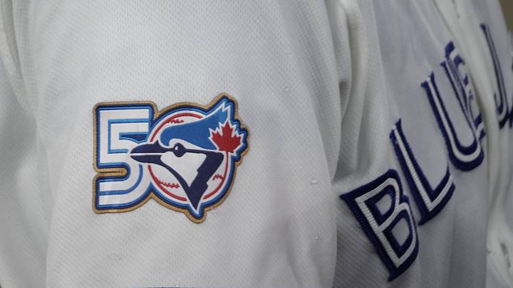 Mar 29, 2026; Toronto, Ontario, CAN; The Toronto Blue Jays 50th anniversary logo displayed on the jersey of third baseman Kazuma Okamoto (7) duringa game against the Athletics  at Rogers Centre. Mandatory Credit: John E. Sokolowski-Imagn Images