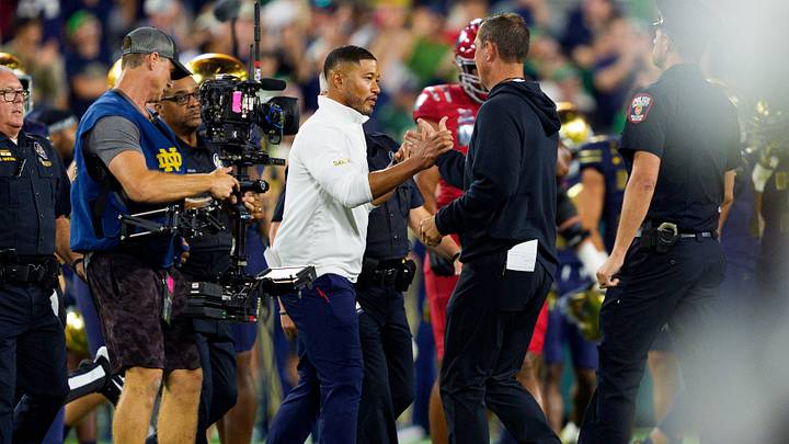 Notre Dame head coach Marcus Freeman, left, and Wisconsin head coach Luke Fickell shake hands after a NCAA football game at Lambeau Field on Sunday, Sept. 6, 2026, in Green Bay, WI. Notre Dame won 41-13.